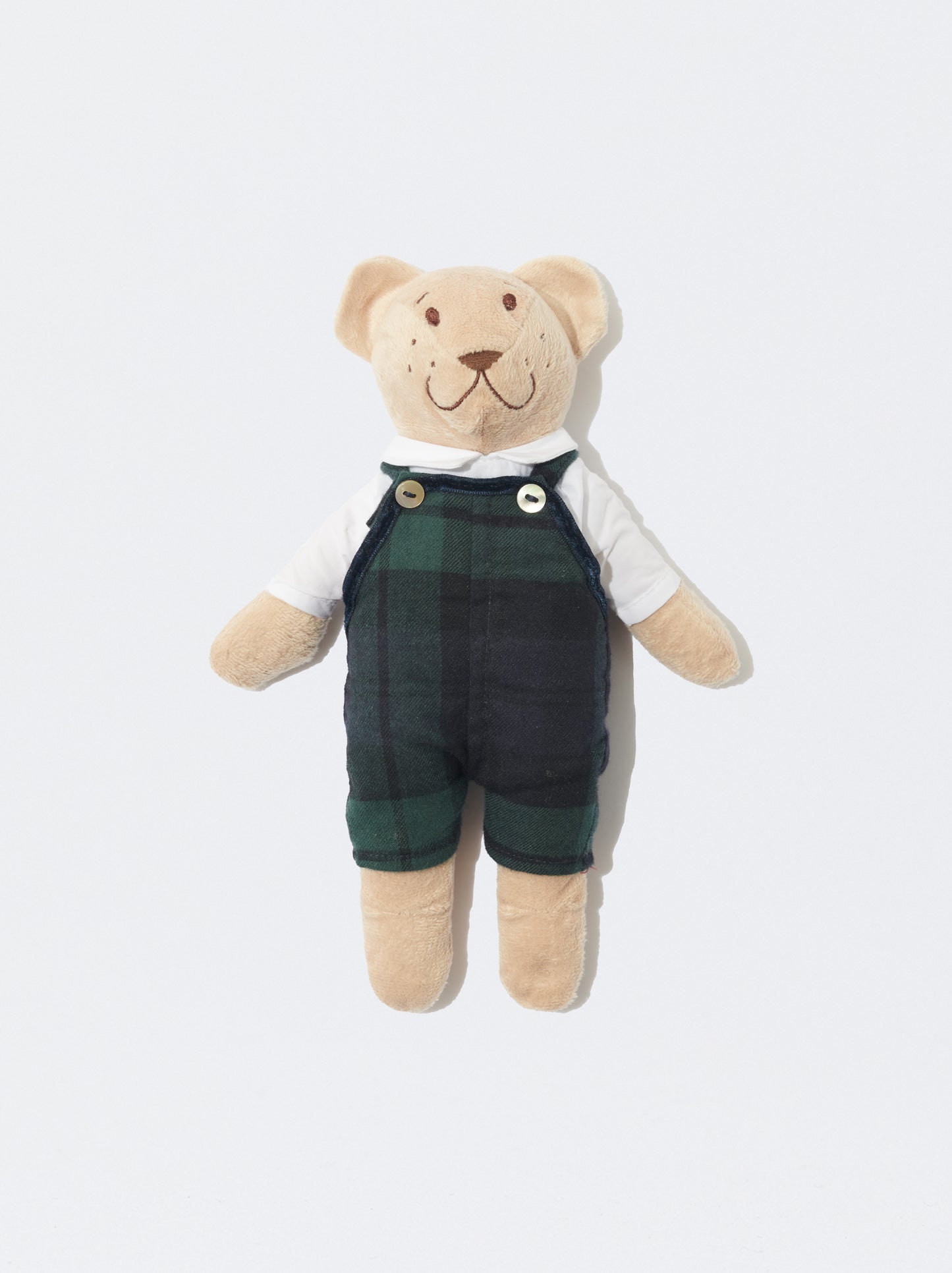 Tom com jardineiras xadrez verde