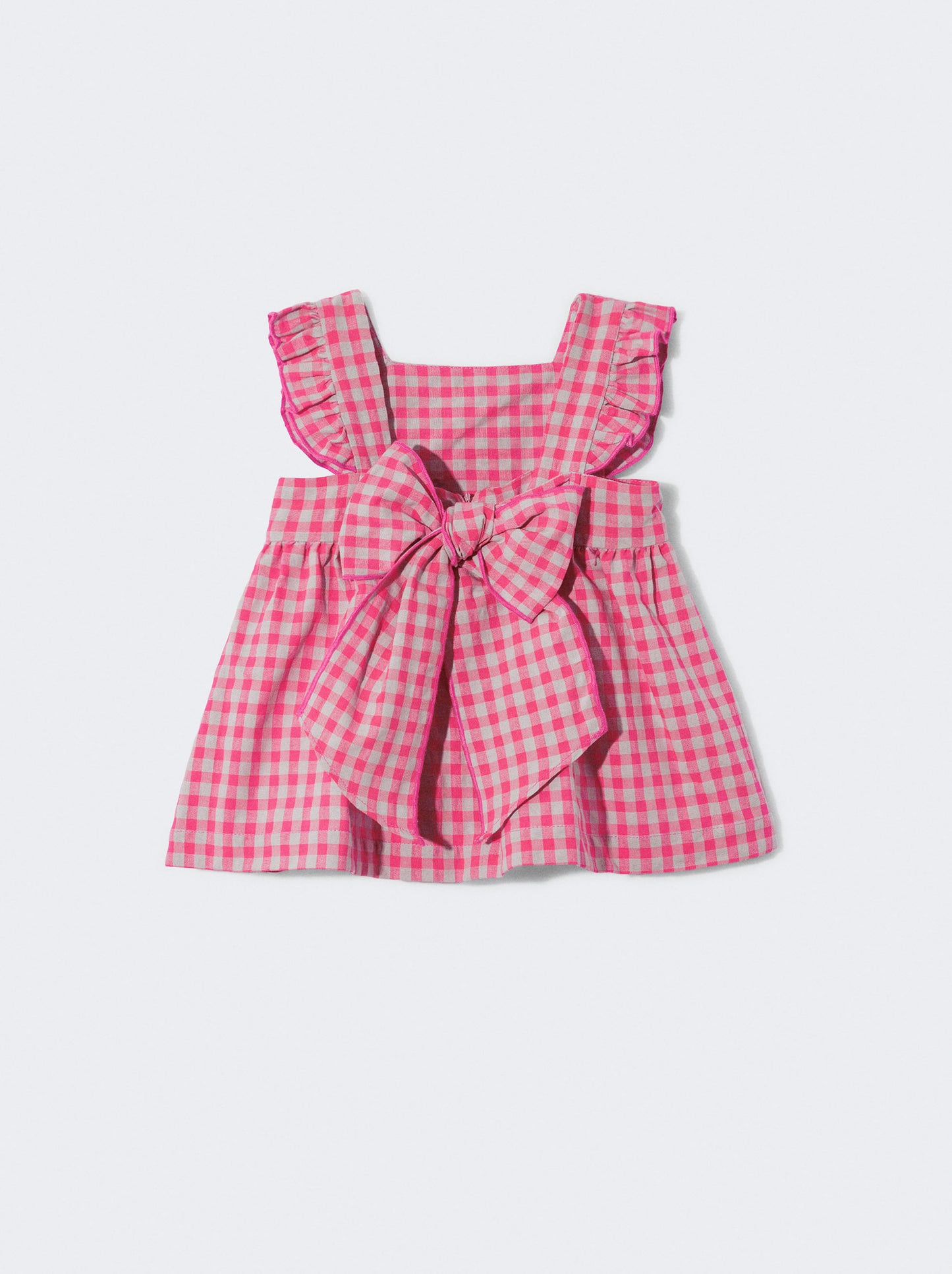 Vestido com laço nas costas