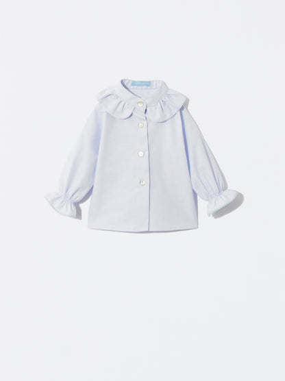 Blusa azul com detalhe de folho