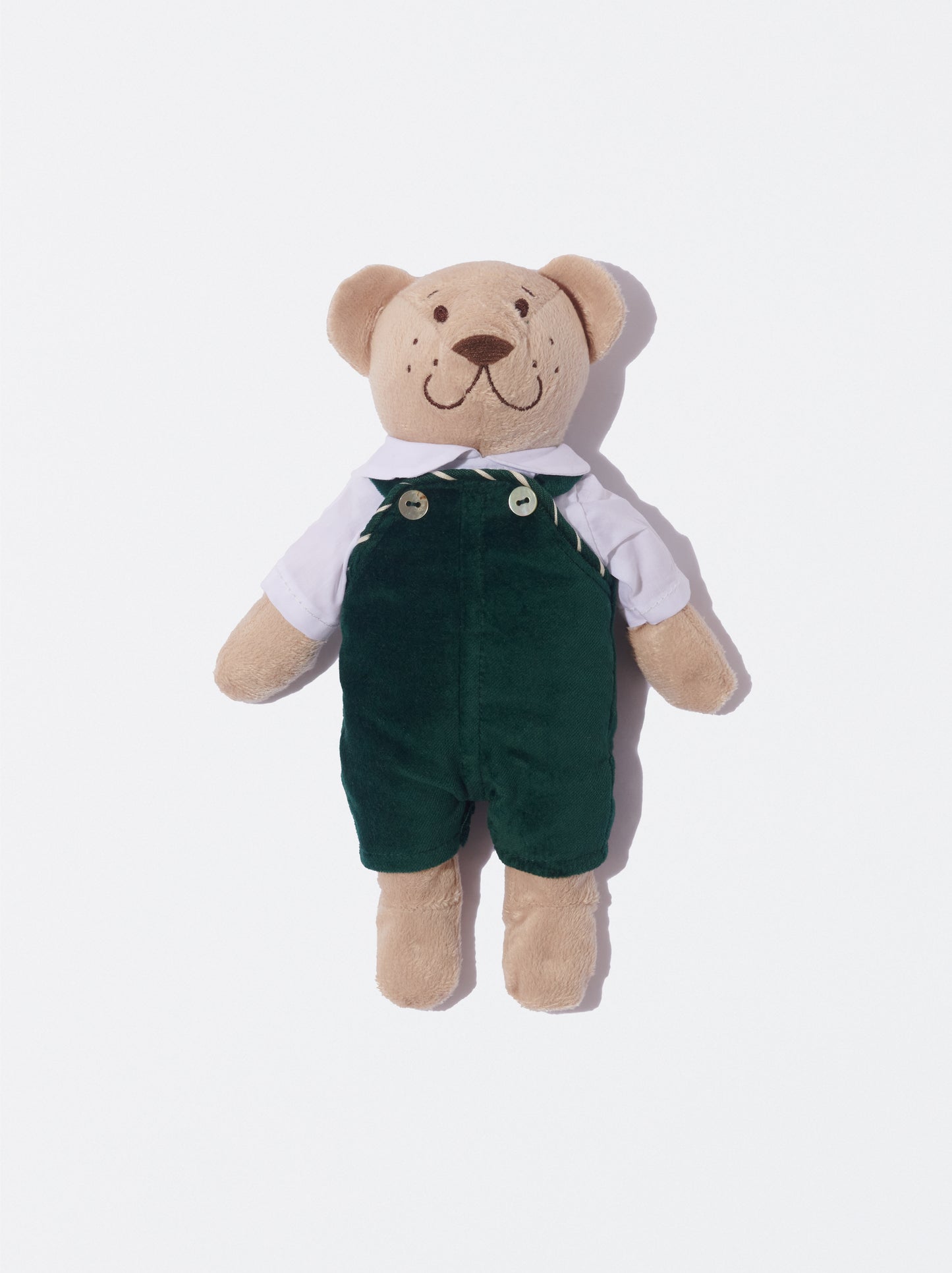 Tom com jardineiras de veludo