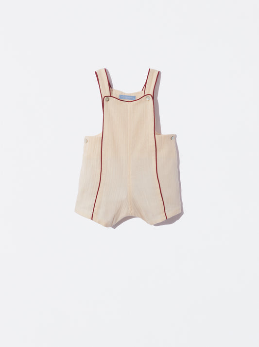 Jardineira bege com detalhe bordeaux