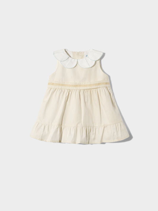 Vestido amarelo com gola de flor